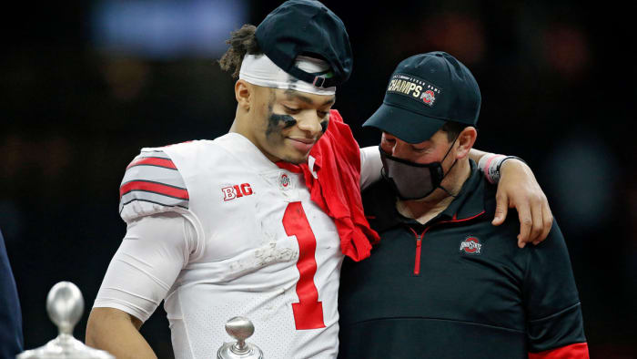 Ohio State Buckeyes head coach Ryan Day and quarterback Justin Fields (1) share a moment after Fields was awarded the Most Outstanding Player award after beating Clemson Tigers 49-28 in the College Fo...